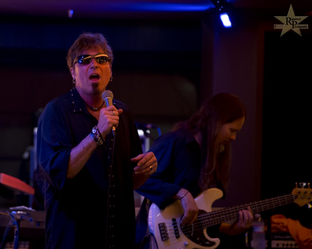 Tim Marshall (lead vocals) and Joe Parker (bass, vocals) perform with the Prog Rock Orchestra on the 2014 YES Cruise to the Edge - Day Three.  (Photo courtesy of Rajaniemi Photography.)